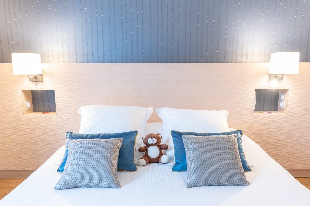 double bed with teddy bear - appart hotel deauville