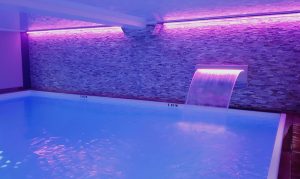 Swimming pool with jet and violet light - hotel in Deauville with swimming pool